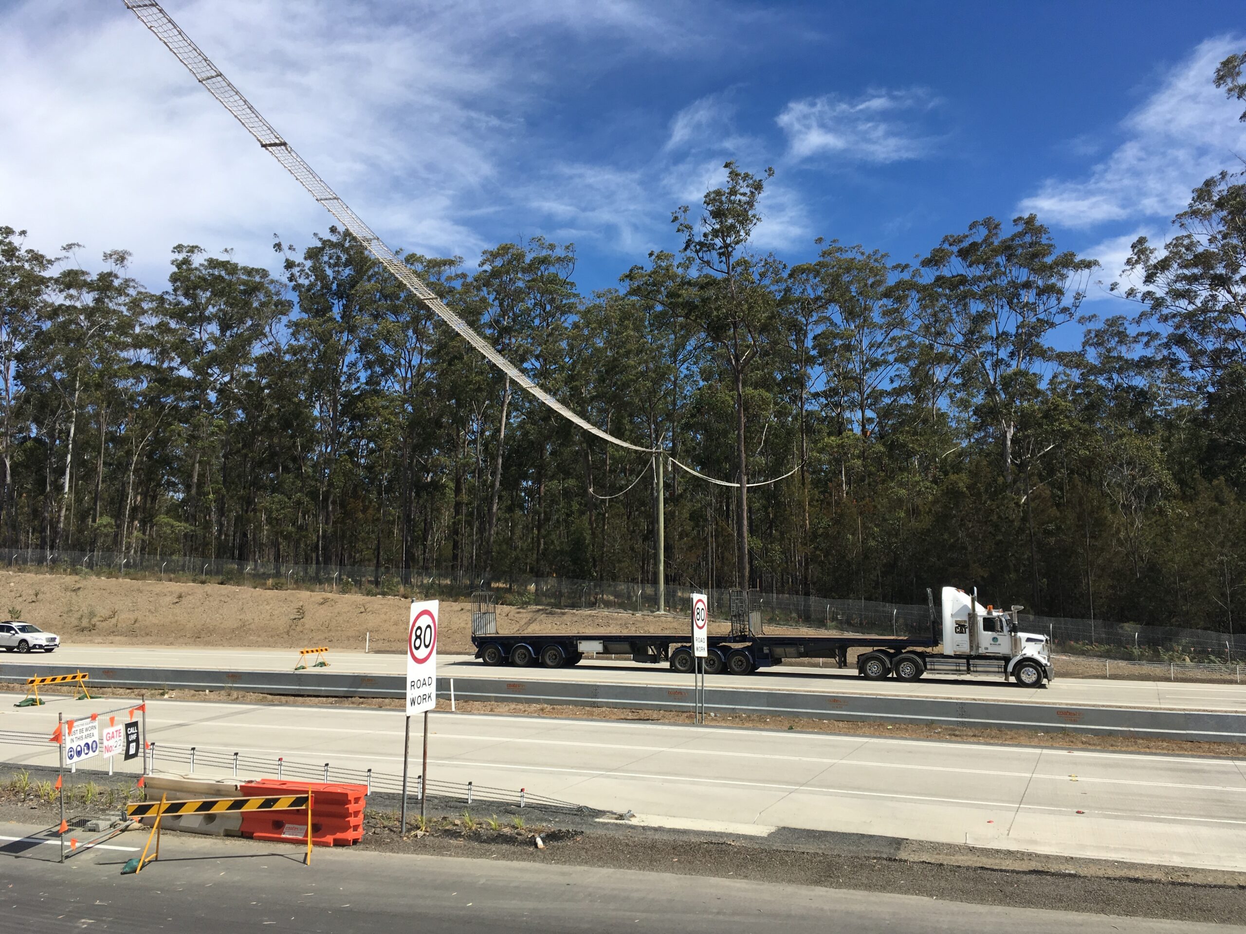 Aerial rope bridge being installed at the project site to support wildlife crossings